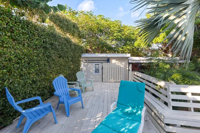 a view of a garden with a bench in the patio