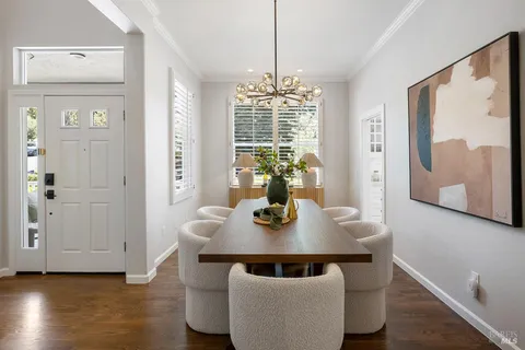 a view of a dining room with furniture window and wooden floor