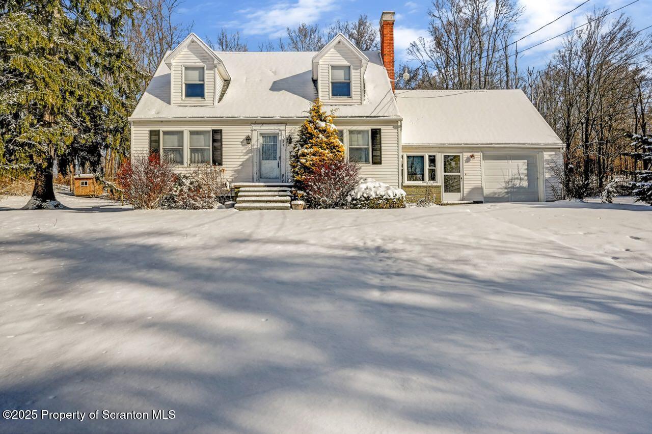 117 Griffin Pond Road Clarks Summit, PA 18411 - Photo 1 of 65 a front view of a house with a garden