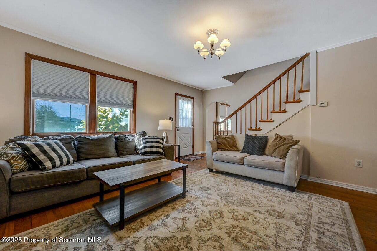 117 Griffin Pond Road Clarks Summit, PA 18411 - Photo 12 of 65 a living room with furniture and a chandelier