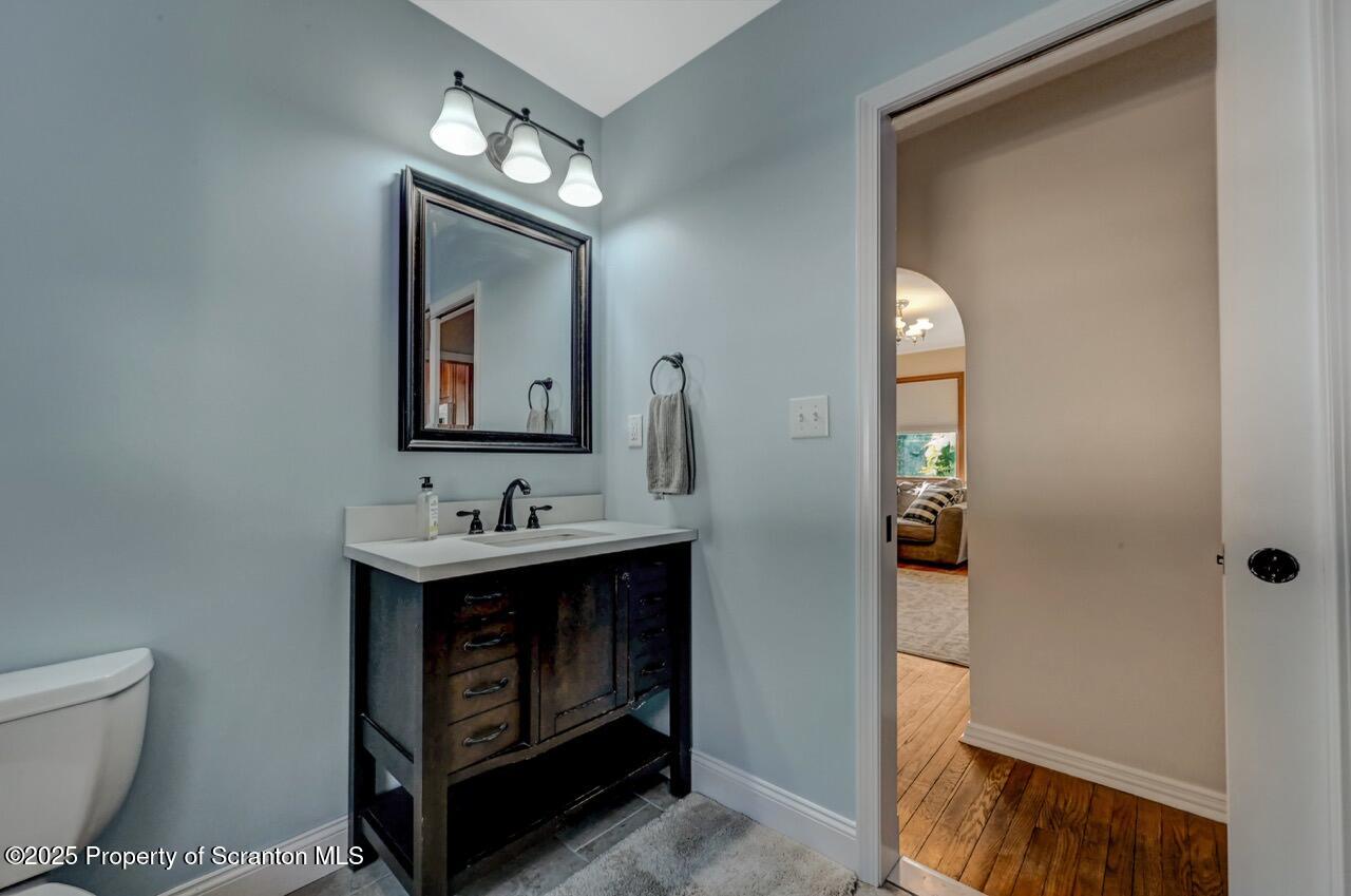 117 Griffin Pond Road Clarks Summit, PA 18411 - Photo 26 of 65 a bathroom with a sink and a mirror