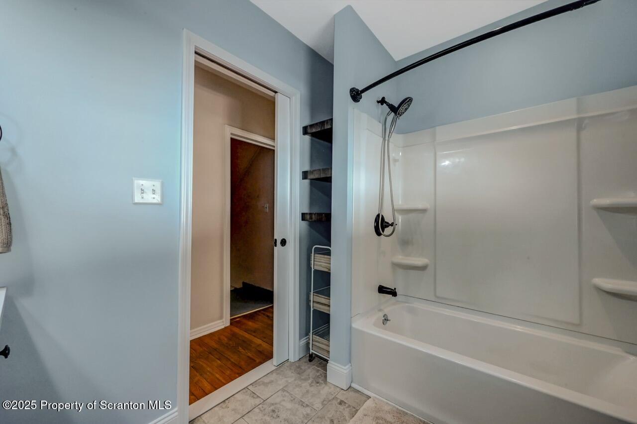 117 Griffin Pond Road Clarks Summit, PA 18411 - Photo 27 of 65 a bathroom with a bathtub and a shower