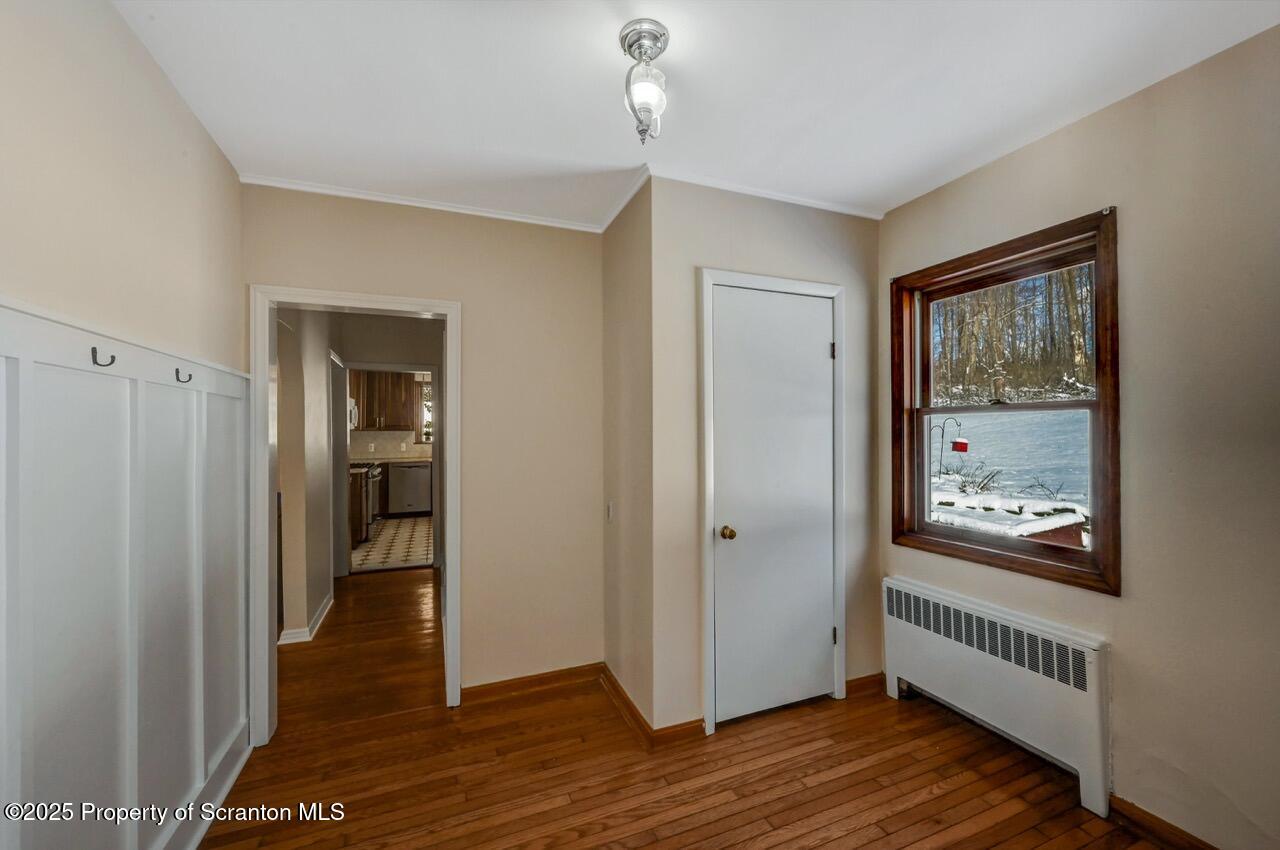 117 Griffin Pond Road Clarks Summit, PA 18411 - Photo 28 of 65 a view of a room with wooden floor cabinet and windows