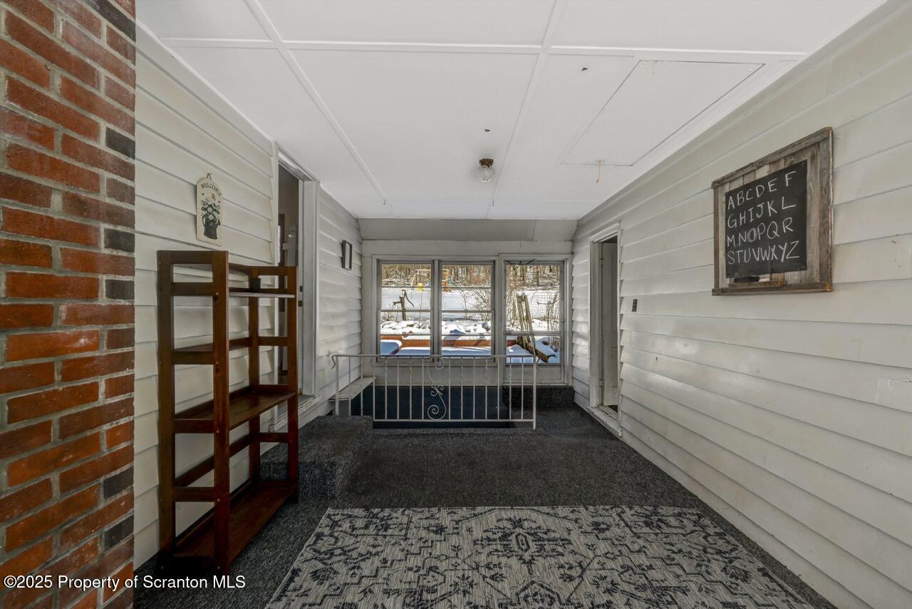 117 Griffin Pond Road Clarks Summit, PA 18411 - Photo 32 of 65 a room with window and a rug