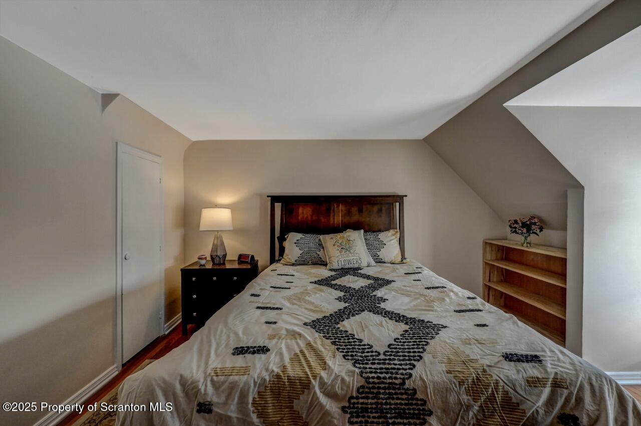 117 Griffin Pond Road Clarks Summit, PA 18411 - Photo 37 of 65 a bedroom with a bed and a walk in closet