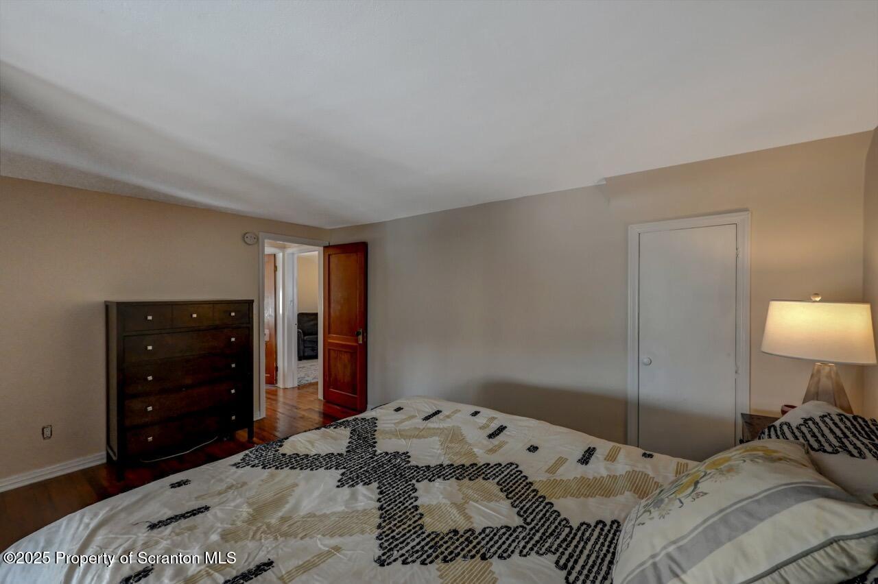 117 Griffin Pond Road Clarks Summit, PA 18411 - Photo 40 of 65 a bedroom with a bed and a lamp