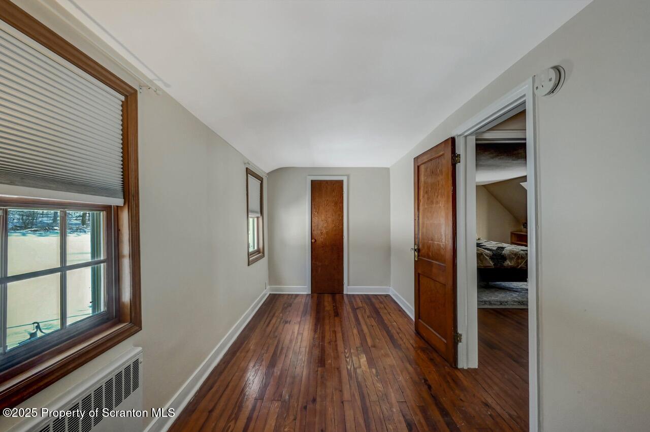 117 Griffin Pond Road Clarks Summit, PA 18411 - Photo 47 of 65 a view of a hallway with wooden floor and closet