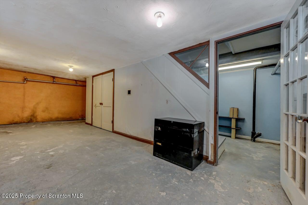 117 Griffin Pond Road Clarks Summit, PA 18411 - Photo 53 of 65 a view of an empty room with a fireplace