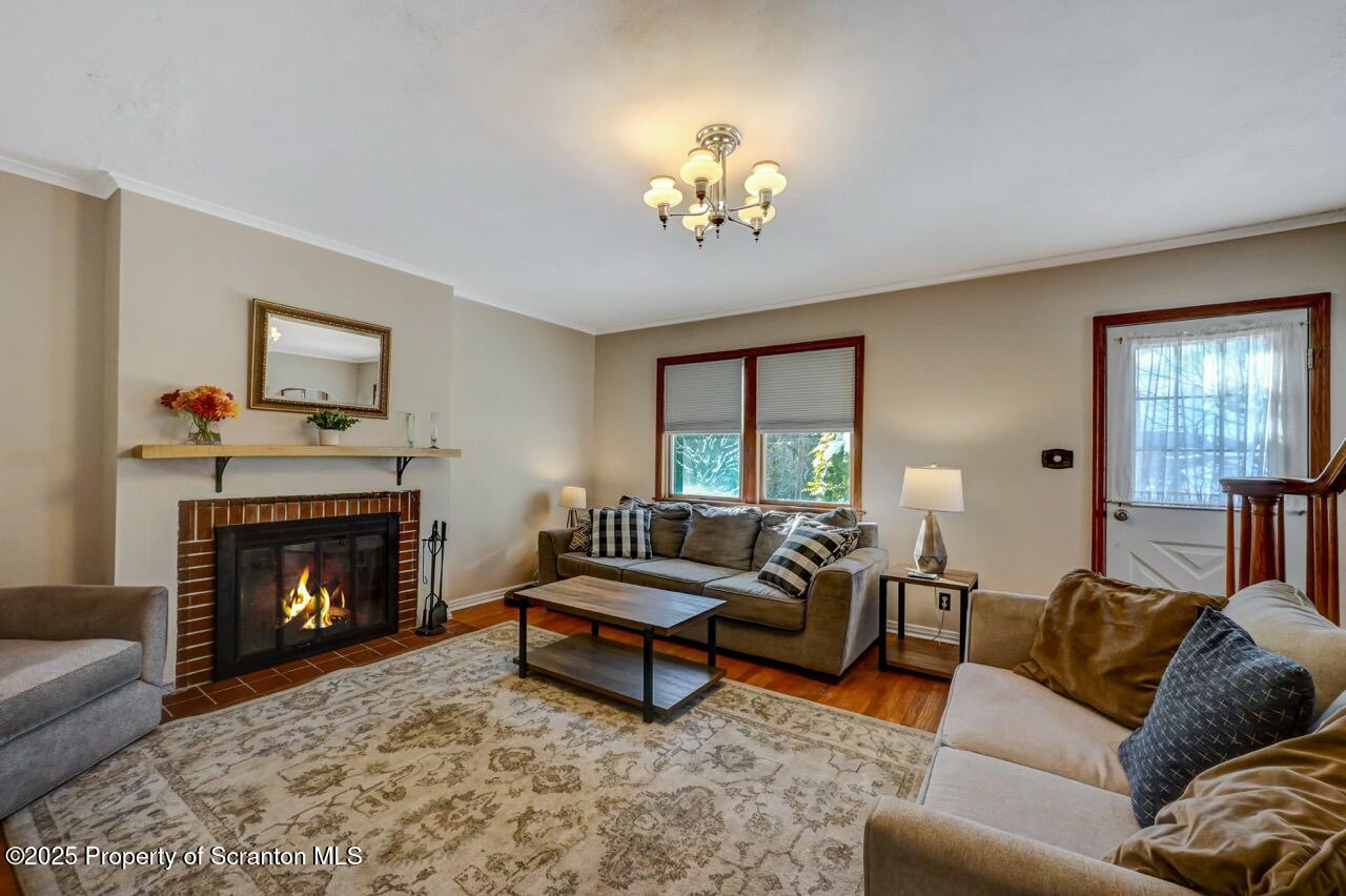 117 Griffin Pond Road Clarks Summit, PA 18411 - Photo 7 of 65 a living room with furniture and a fireplace