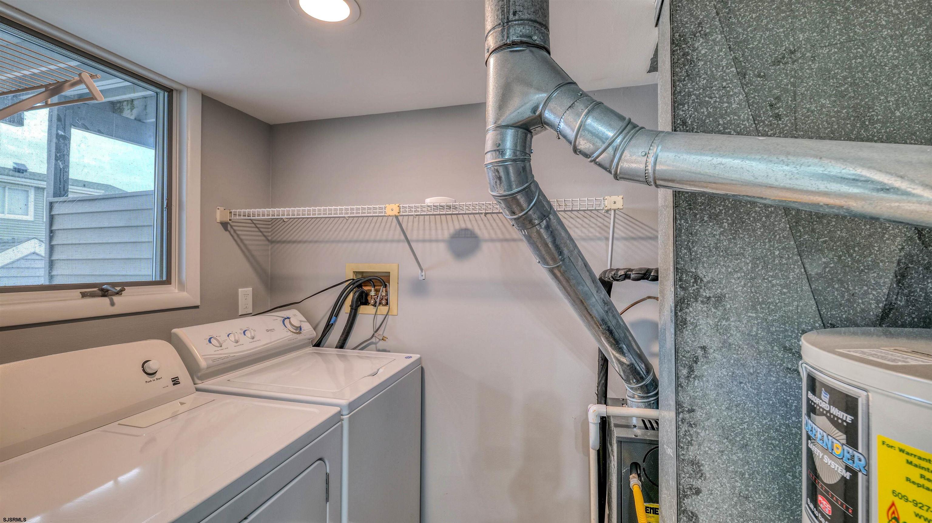 101 11th Street North, Unit A Brigantine, NJ 08203 - Photo 2 of 42 a view of storage and utility room with washer and dryer