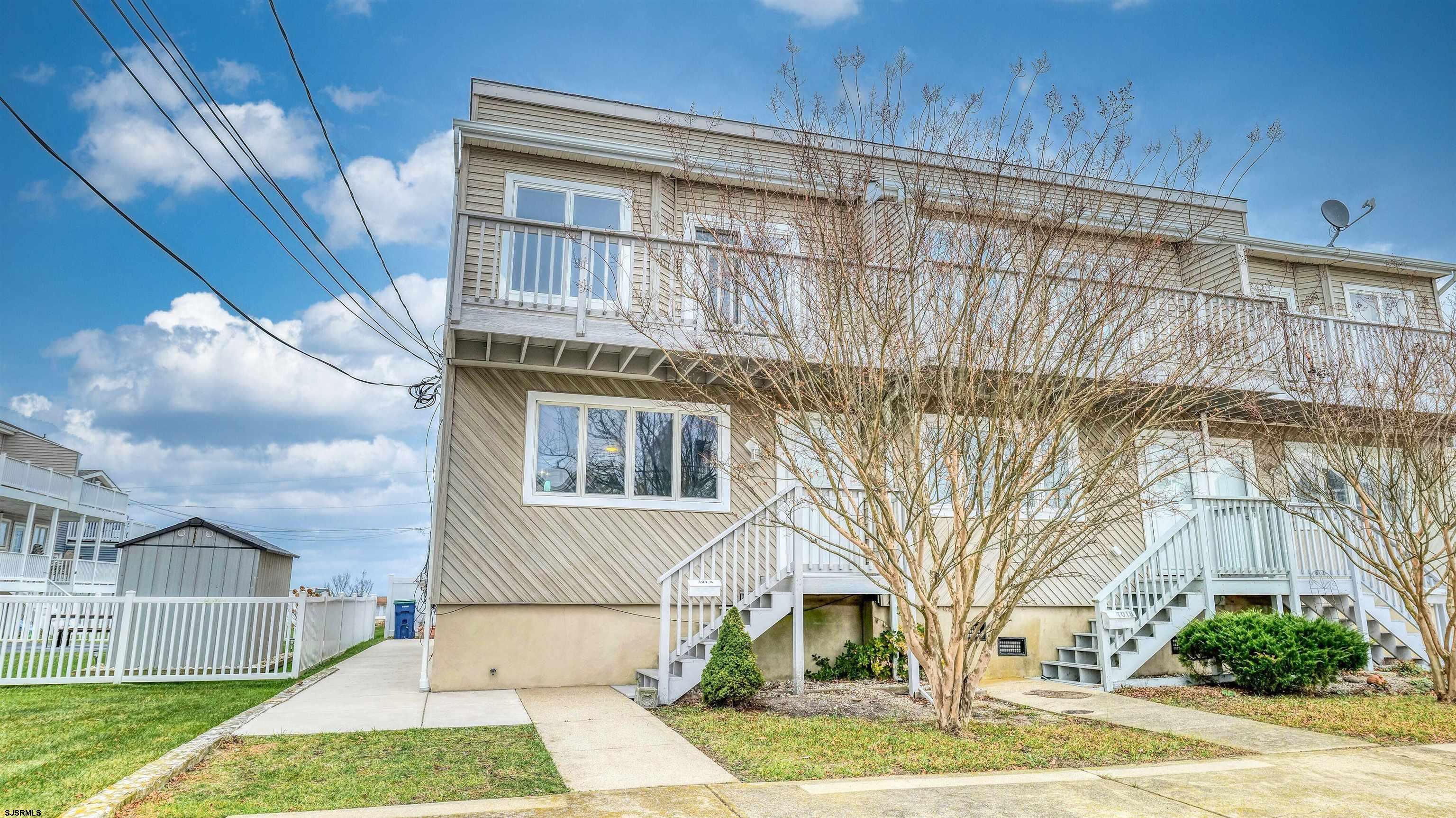 101 11th Street North, Unit A Brigantine, NJ 08203 - Photo 23 of 42 a front view of a house with a yard