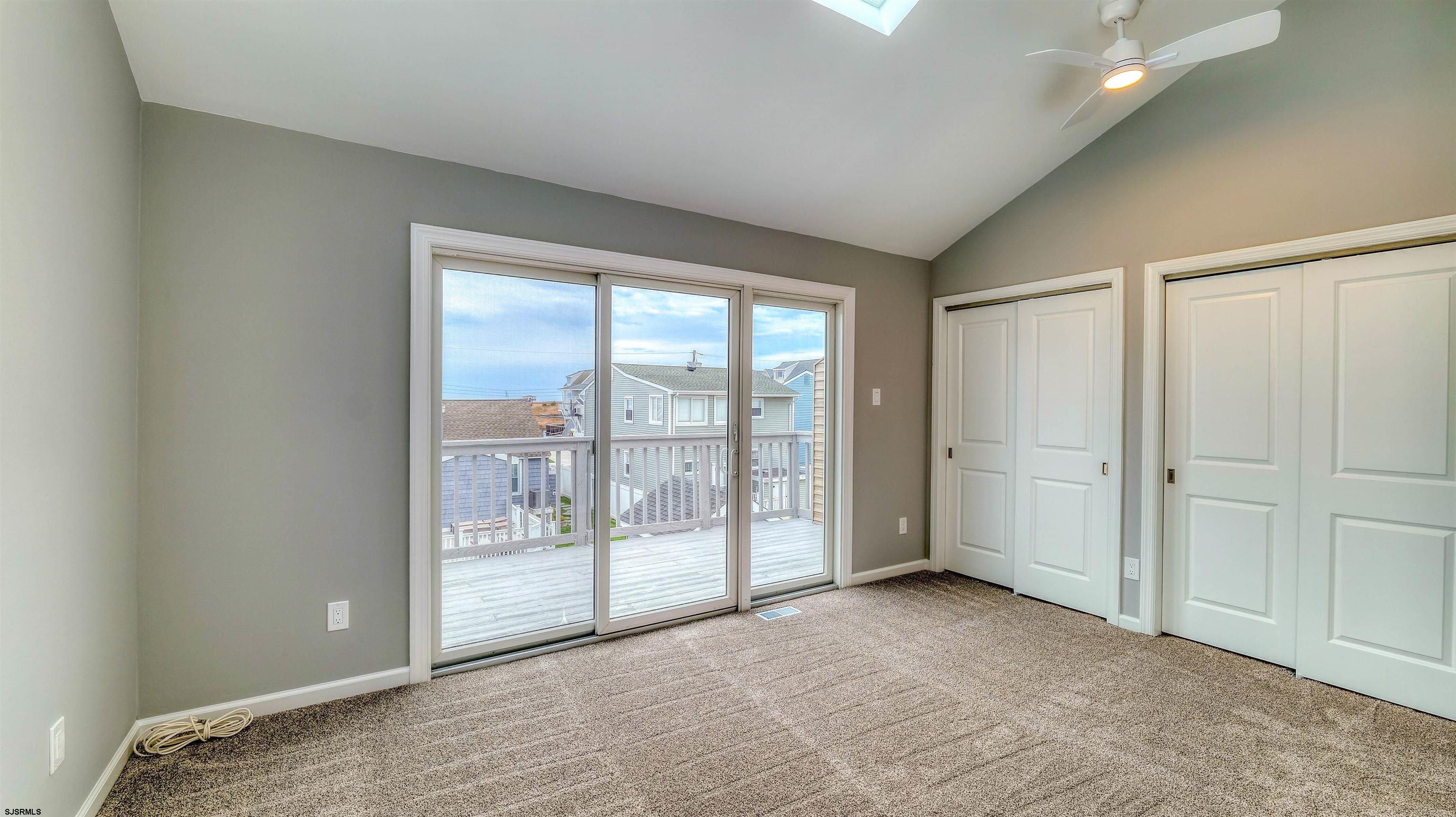 101 11th Street North, Unit A Brigantine, NJ 08203 - Photo 5 of 42 a view of an empty room with a window