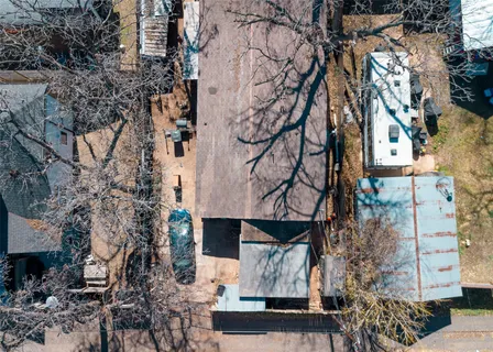 an aerial view of multiple houses with outdoor space