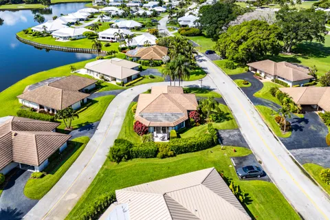 a aerial view of a house with a swimming pool yard and outdoor seating