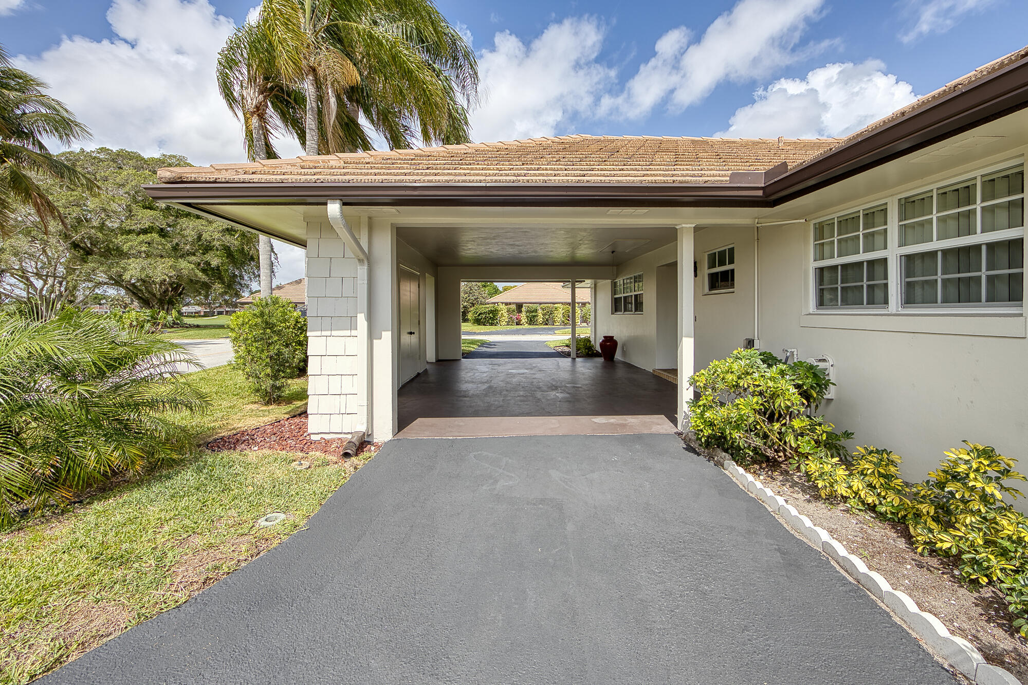 328 Cedar Key Circle Atlantis, FL 33462 - Photo 6 of 28 front view of a house with a yard