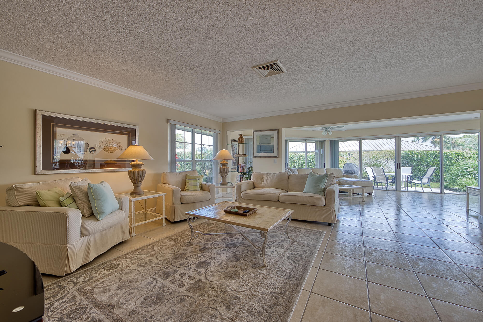 328 Cedar Key Circle Atlantis, FL 33462 - Photo 8 of 28 a living room with furniture and a large window