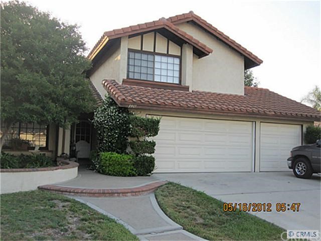 3917 Rancho Reina Court Riverside, CA 92505 - Photo 1 of 1 a front view of a house with a garden