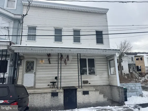 a front view of a house with parking