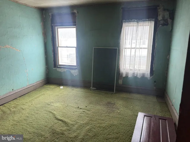 an empty room with windows