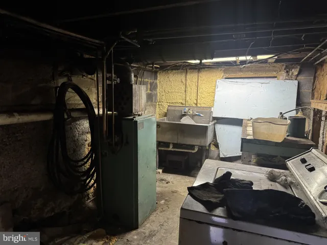 a storage and utility room with washer and dryer