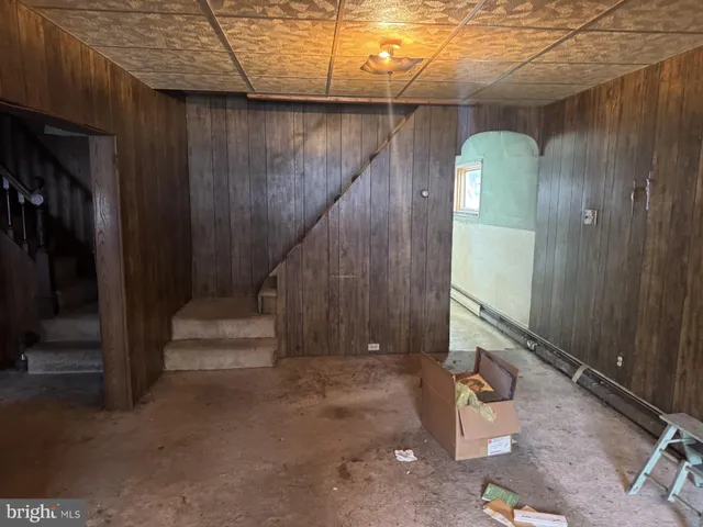 a view of entryway with wooden walls