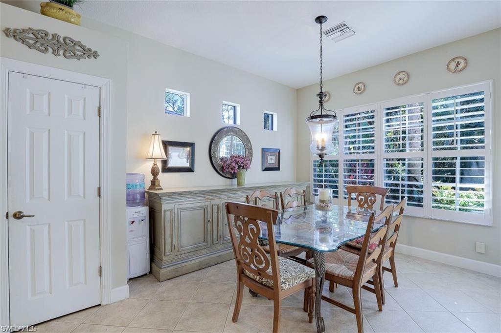 16156 Parque Lane Naples, FL 34110 - Photo 15 of 21 a view of a dining room and chairs in a room