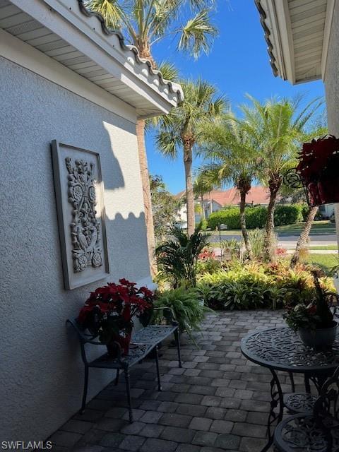 16156 Parque Lane Naples, FL 34110 - Photo 18 of 21 a backyard of a house with table and chairs