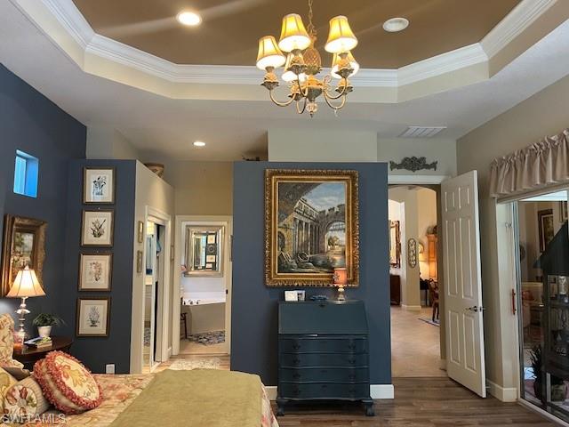 16156 Parque Lane Naples, FL 34110 - Photo 19 of 21 a view of a bedroom with bed and hallway