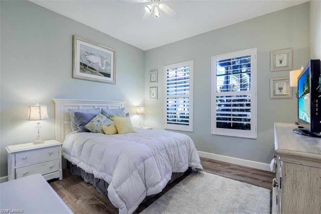 16156 Parque Lane Naples, FL 34110 - Photo 2 of 21 a bedroom with a bed and a flat screen tv