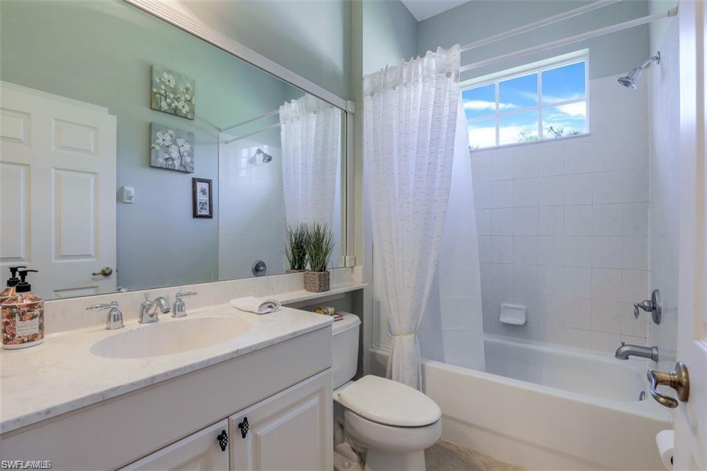 16156 Parque Lane Naples, FL 34110 - Photo 5 of 21 a bathroom with a sink toilet and shower