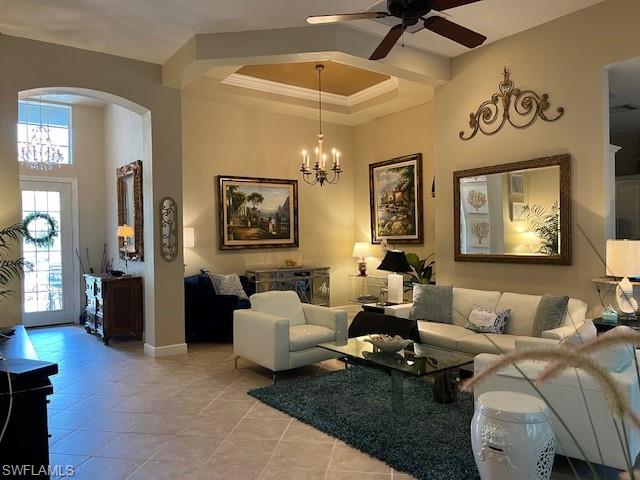 16156 Parque Lane Naples, FL 34110 - Photo 6 of 21 a living room with furniture and a chandelier