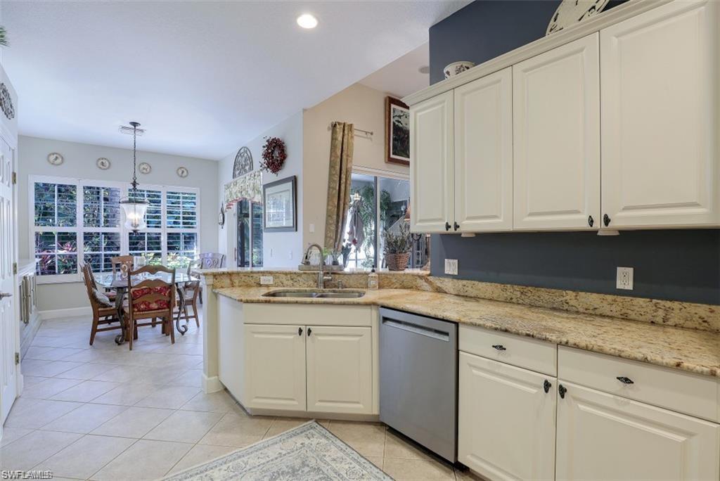 16156 Parque Lane Naples, FL 34110 - Photo 7 of 21 a kitchen with a sink and cabinets