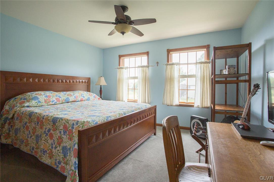 453 Colver Road Nazareth, PA 18064 - Photo 13 of 22 a bedroom with a bed and a flat screen tv on the dresser