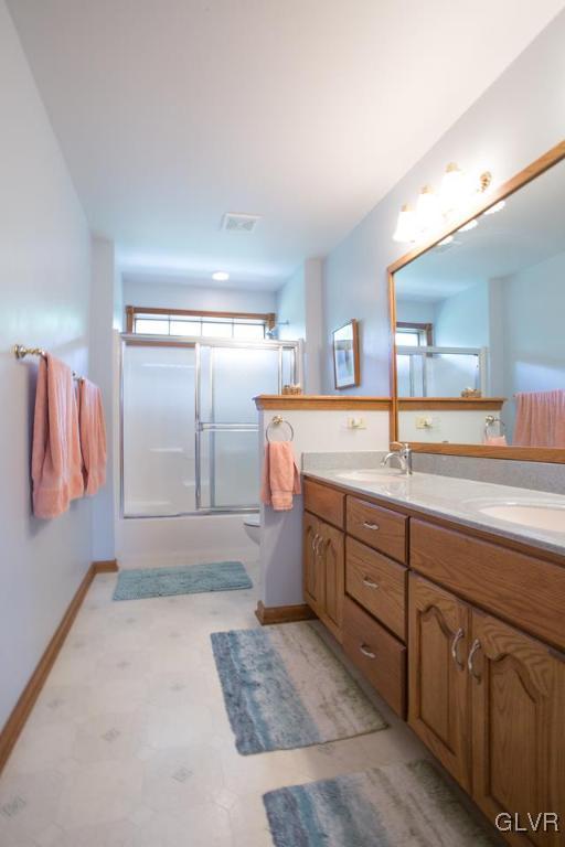 453 Colver Road Nazareth, PA 18064 - Photo 14 of 22 a spacious bathroom with a granite countertop sink and a mirror