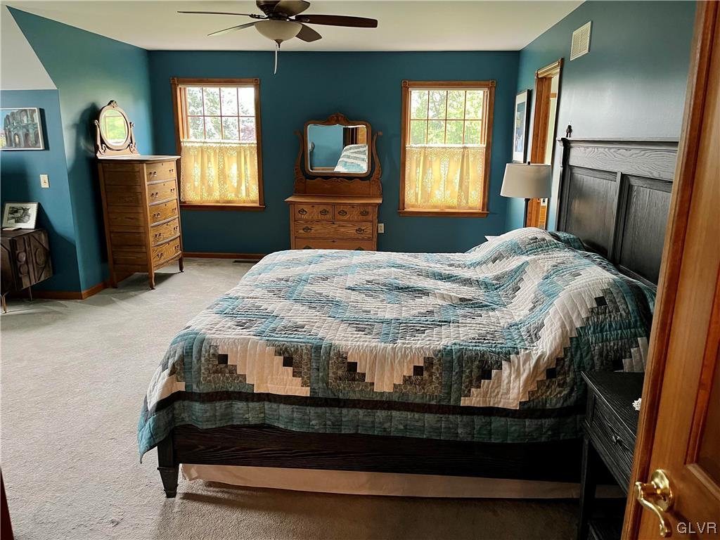 453 Colver Road Nazareth, PA 18064 - Photo 16 of 22 a bedroom with a bed and window with mirror