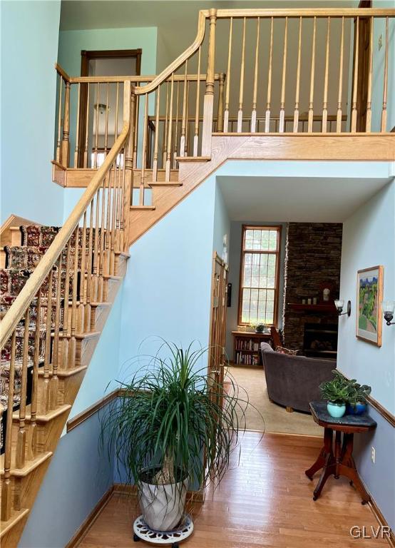 453 Colver Road Nazareth, PA 18064 - Photo 3 of 22 a living room with wooden floor stairs and a potted plant