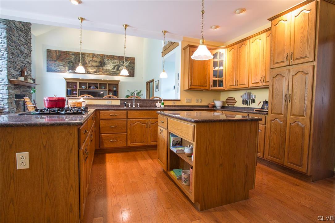 453 Colver Road Nazareth, PA 18064 - Photo 8 of 22 a kitchen with stainless steel appliances granite countertop a sink a stove and refrigerator