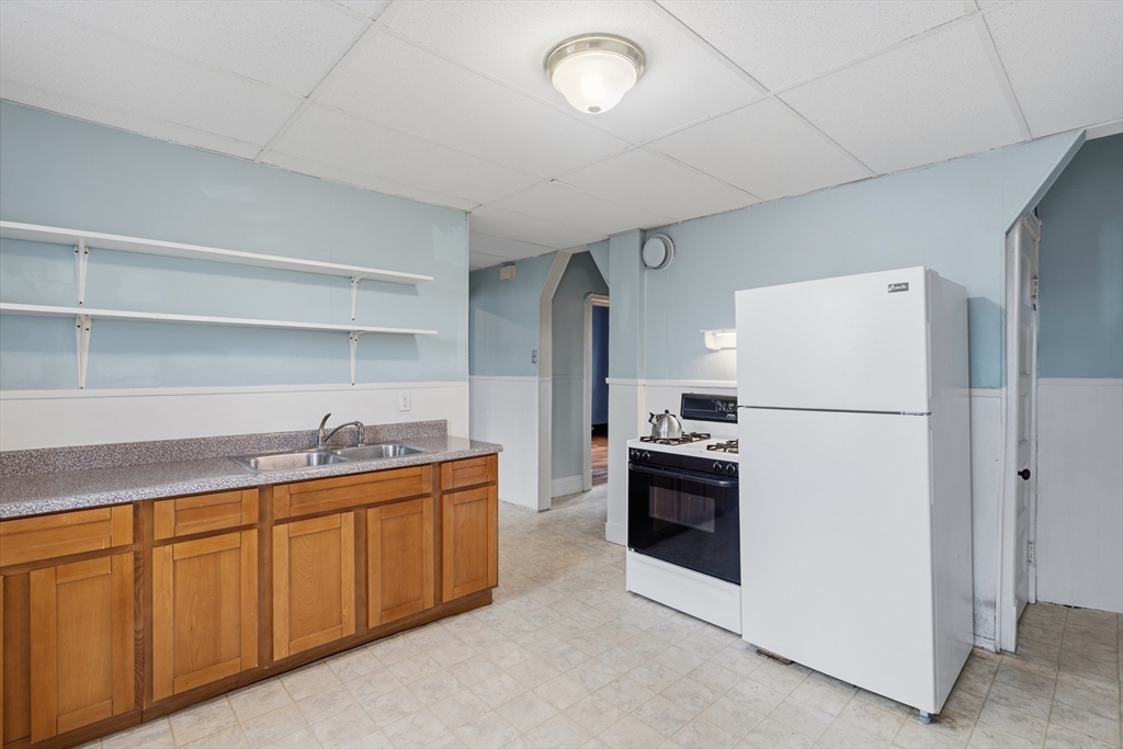 43 Elmdale Street, Unit 2 West Springfield, MA 01089 - Photo 11 of 14 a kitchen with stainless steel appliances a refrigerator sink and cabinets