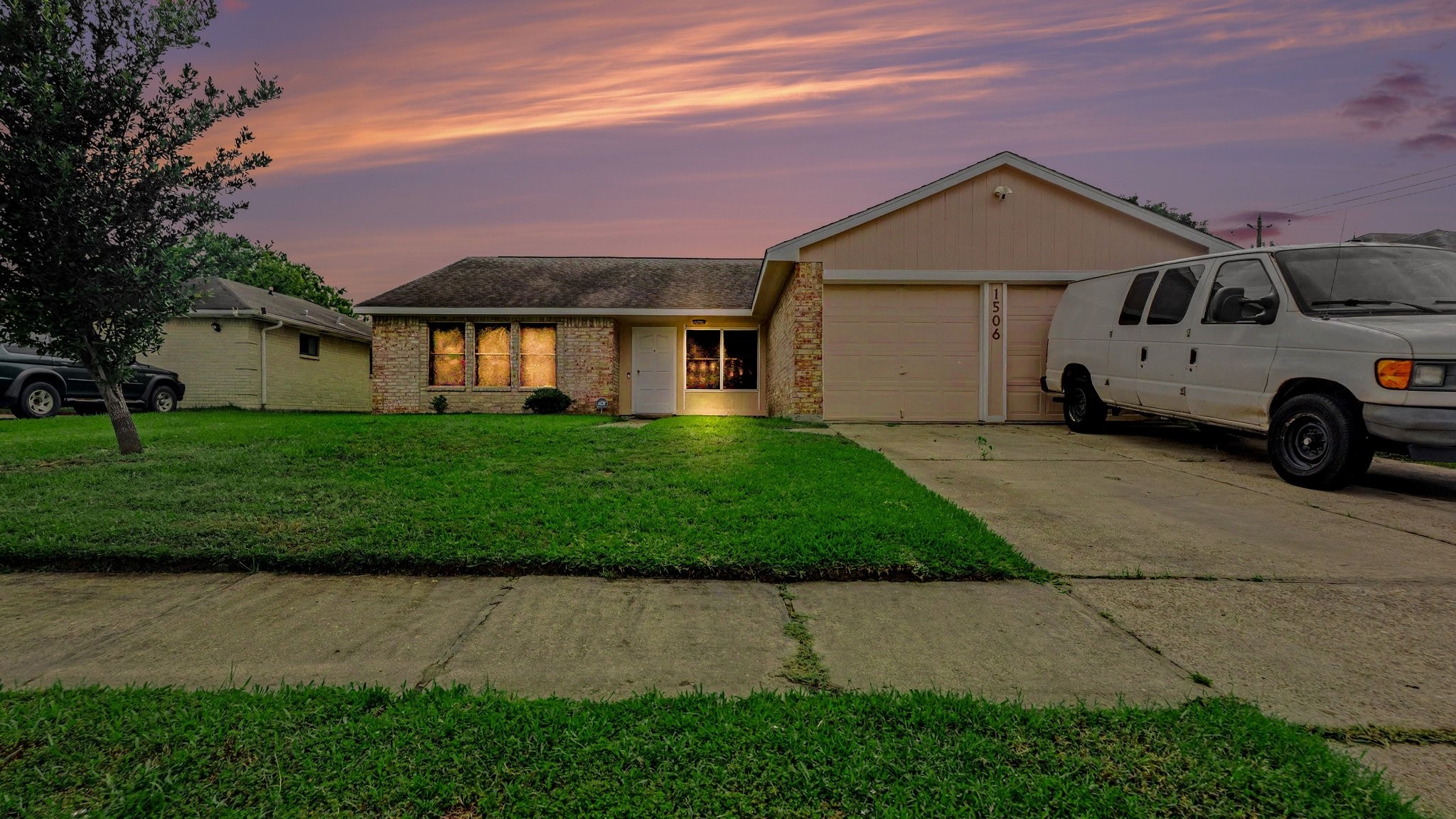 1506 Holbech Lane Channelview, TX 77530 - Photo 1 of 21 a front view of a house with a yard and garage