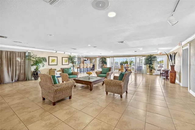 a lobby with furniture and floor to ceiling window