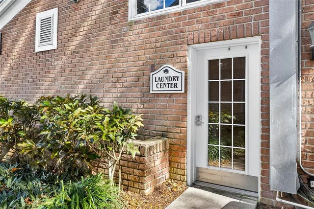a view of front door of house and stairs