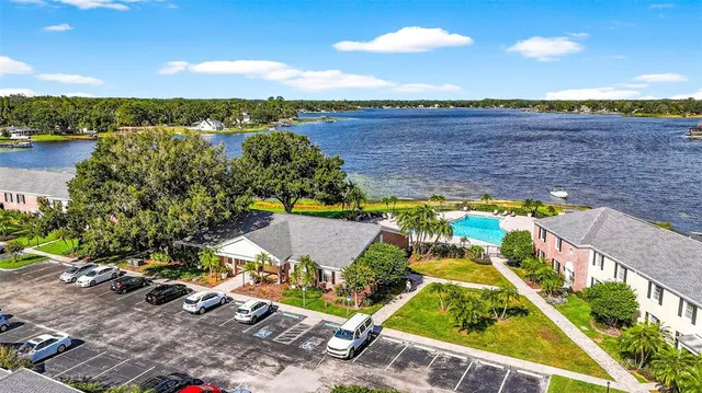 an aerial view of house with yard swimming pool and outdoor seating
