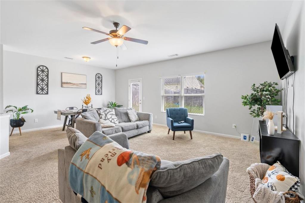 4219 Box Elder Path Gainesville, GA 30504 - Photo 3 of 35 a living room with furniture potted plant and a window