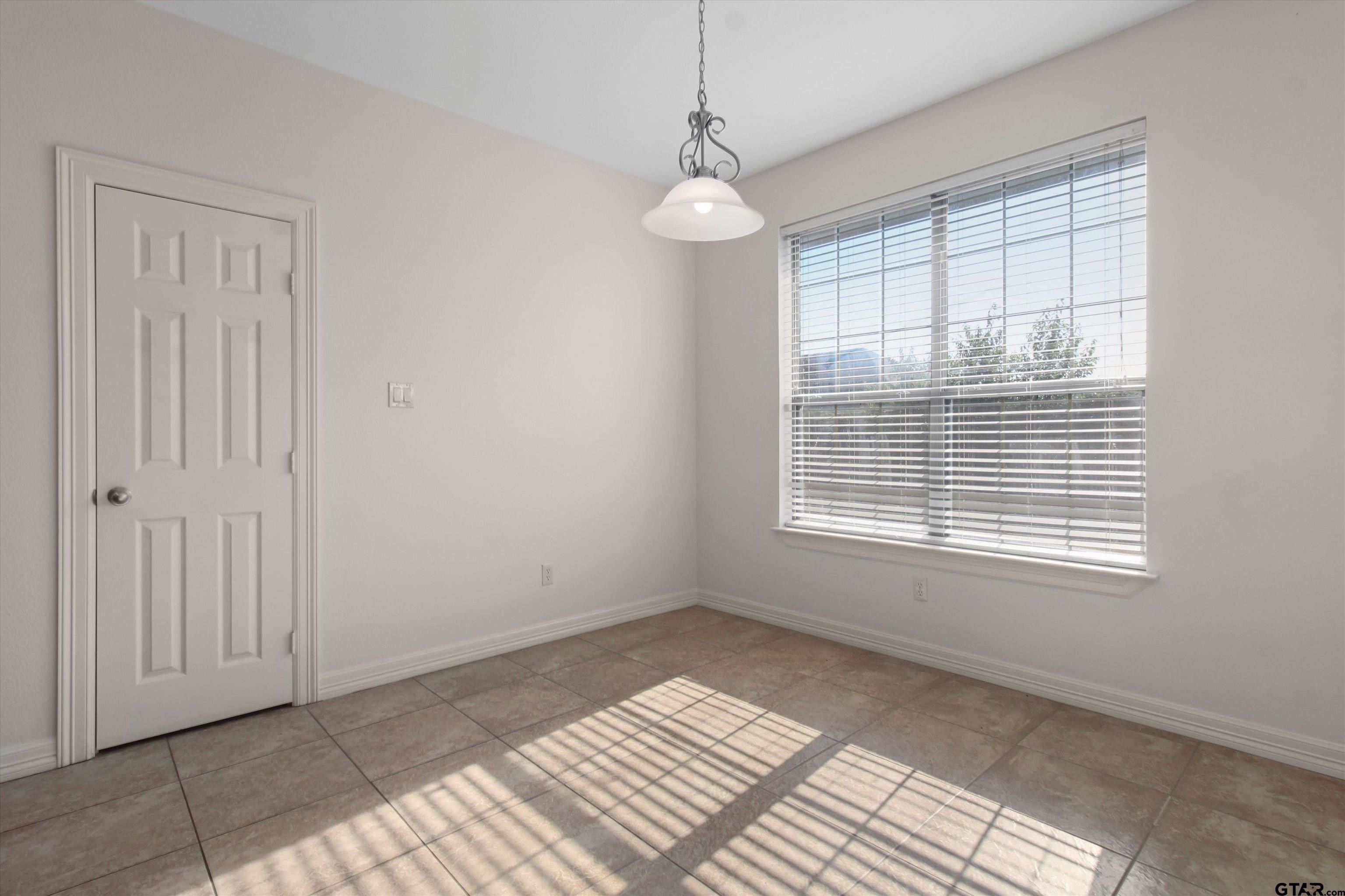 452 Princess Place Tyler, TX 75704 - Photo 14 of 20 a view of an empty room with a window