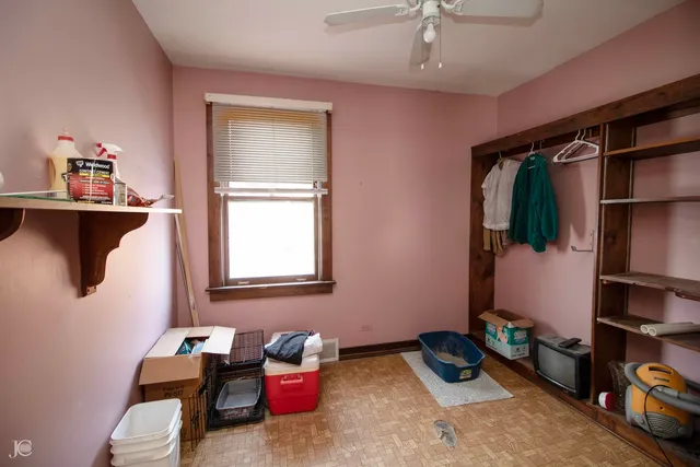 a living room with furniture gym equipment and a window