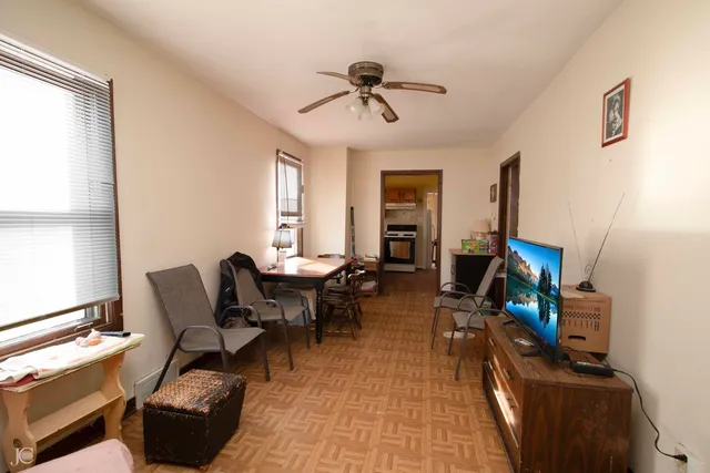 a view of a livingroom with furniture and a window