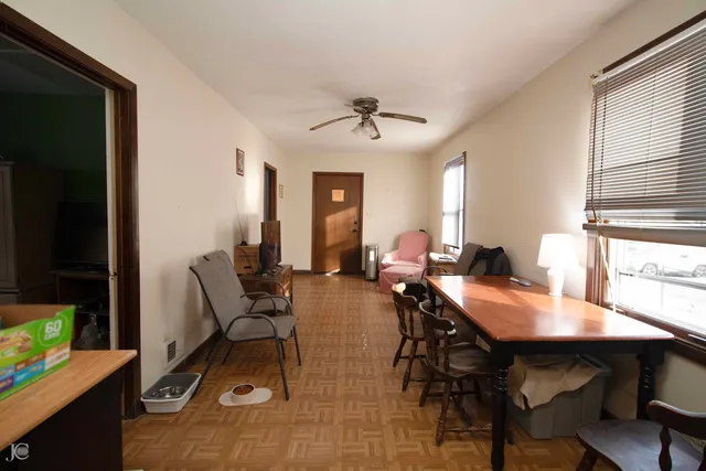 a view of a dining room with furniture and window