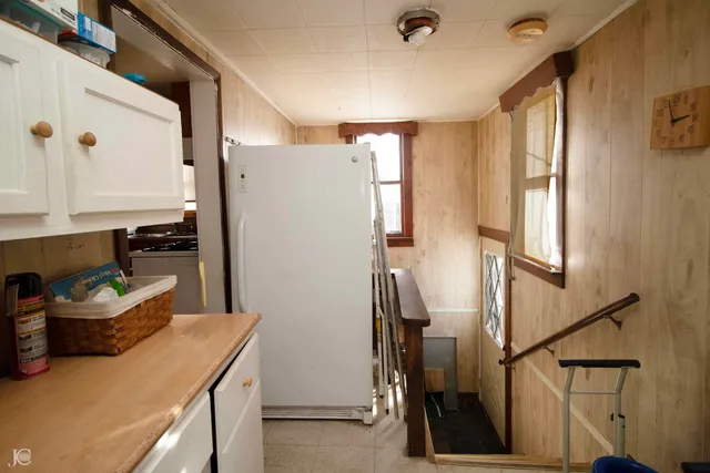 a room with blue cabinets and wooden floor