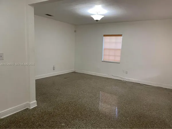 an empty room with a window