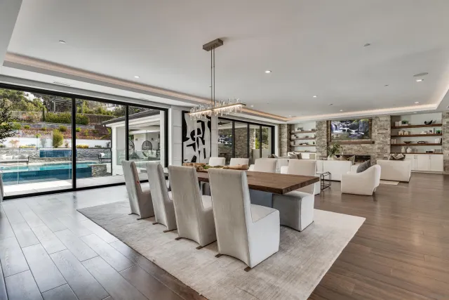 a living room with furniture and view of kitchen